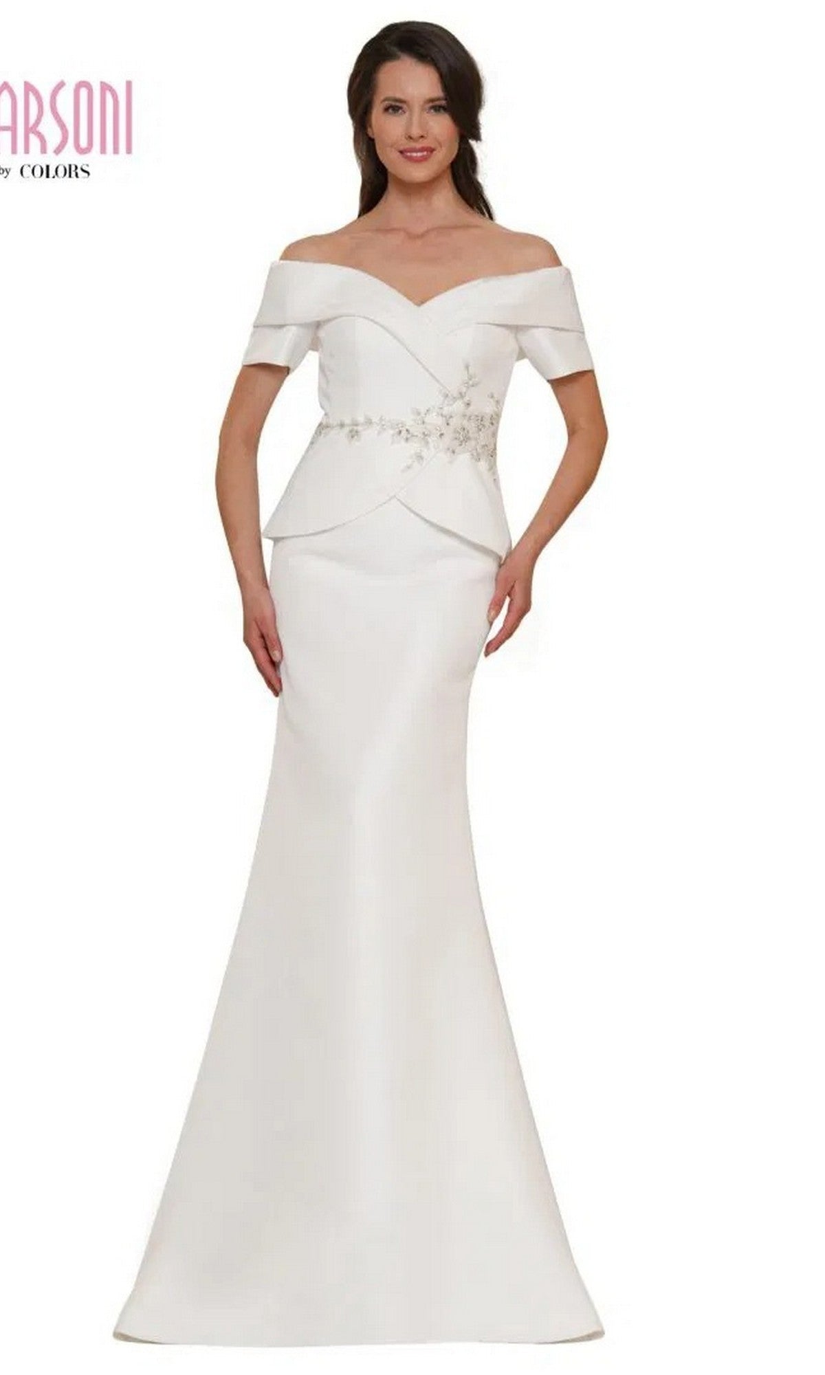 A woman models the Marsoni MV1144 long formal dress in off white, featuring an off-the-shoulder neckline, fitted bodice, beaded peplum detail, floral embellishments, and a flared floor-length skirt for an elegant evening look.
